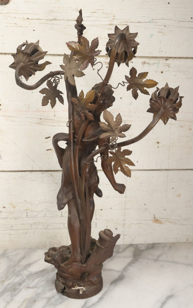 Lot 001 - Antique French Bronzed Spelter Art Nouveau Neo-Classical Revival Figural Lamp Base With Male Figure With Outstretched Arm Holding Torch And Three Curved Lighting Arms With Metal Leaves, Note Lamp Needs Complete Rewiring And Has Metal Damage