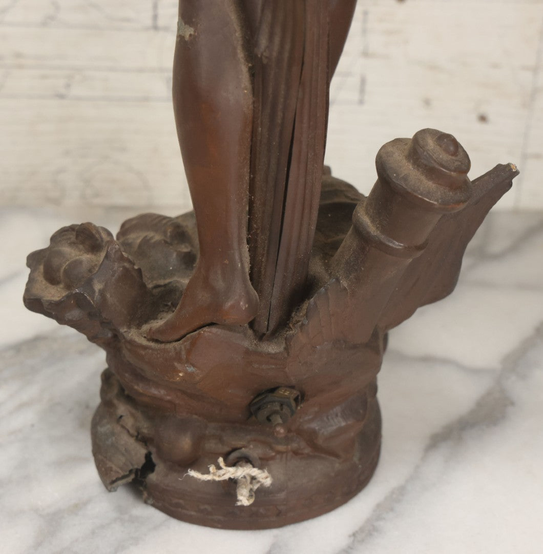 Lot 001 - Antique French Bronzed Spelter Art Nouveau Neo-Classical Revival Figural Lamp Base With Male Figure With Outstretched Arm Holding Torch And Three Curved Lighting Arms With Metal Leaves, Note Lamp Needs Complete Rewiring And Has Metal Damage