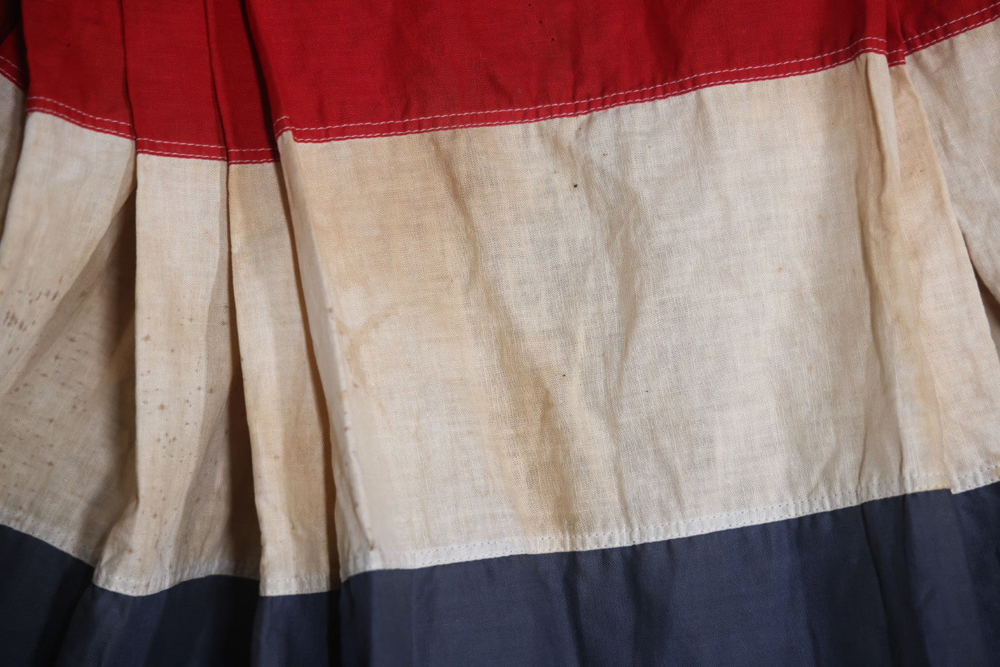 Lot 007 - Vintage Red White And Blue Patriotic Bunting, Note Holes, Fading, And Staining, 76" W x 34" H
