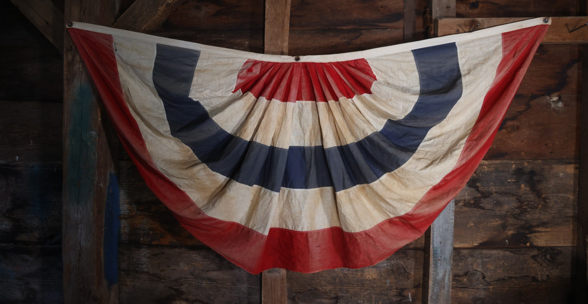 Lot 007 - Vintage Red White And Blue Patriotic Bunting, Note Holes, Fading, And Staining, 76" W x 34" H