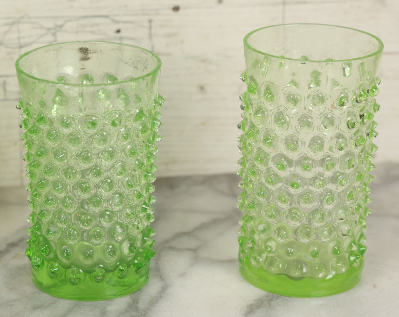 Lot 014 - Vintage Six Piece Hobnail Uranium Glass Drinking Collection With Pitcher And Four Matching Cups Plus Additional Cup, U.V. Blacklight Reactive Glass, Note Chips And Cracks