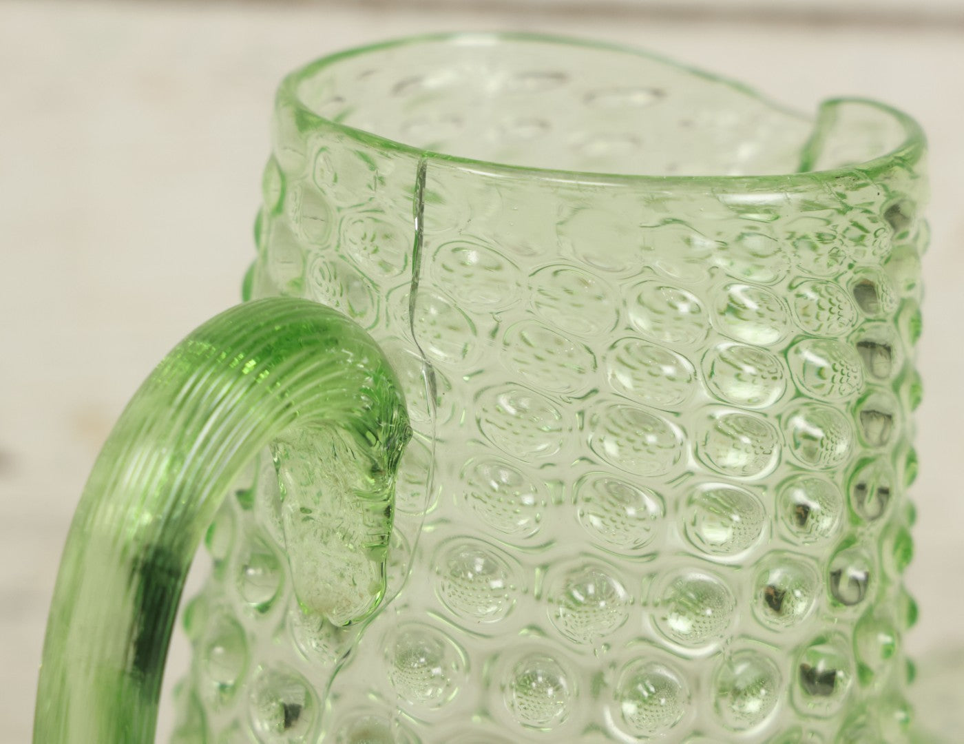 Lot 014 - Vintage Six Piece Hobnail Uranium Glass Drinking Collection With Pitcher And Four Matching Cups Plus Additional Cup, U.V. Blacklight Reactive Glass, Note Chips And Cracks