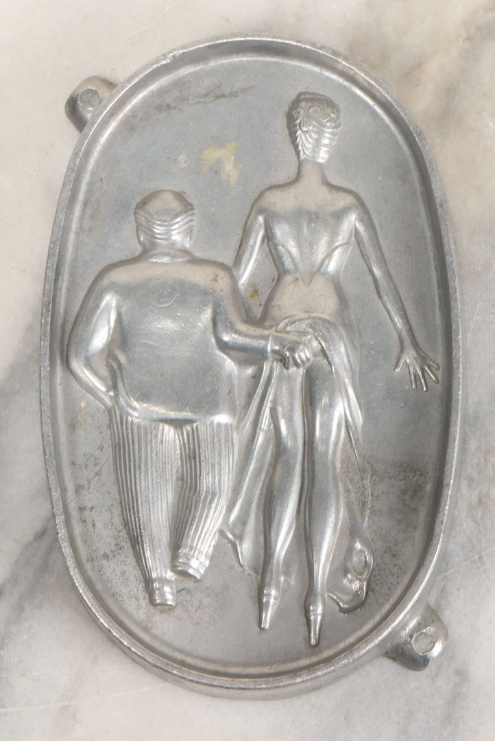 Lot 024 - Vintage Cast Aluminum "Oh! Ah!" Risqué Ashtray With Little Man Grabbing A Surprised Lady's Behind