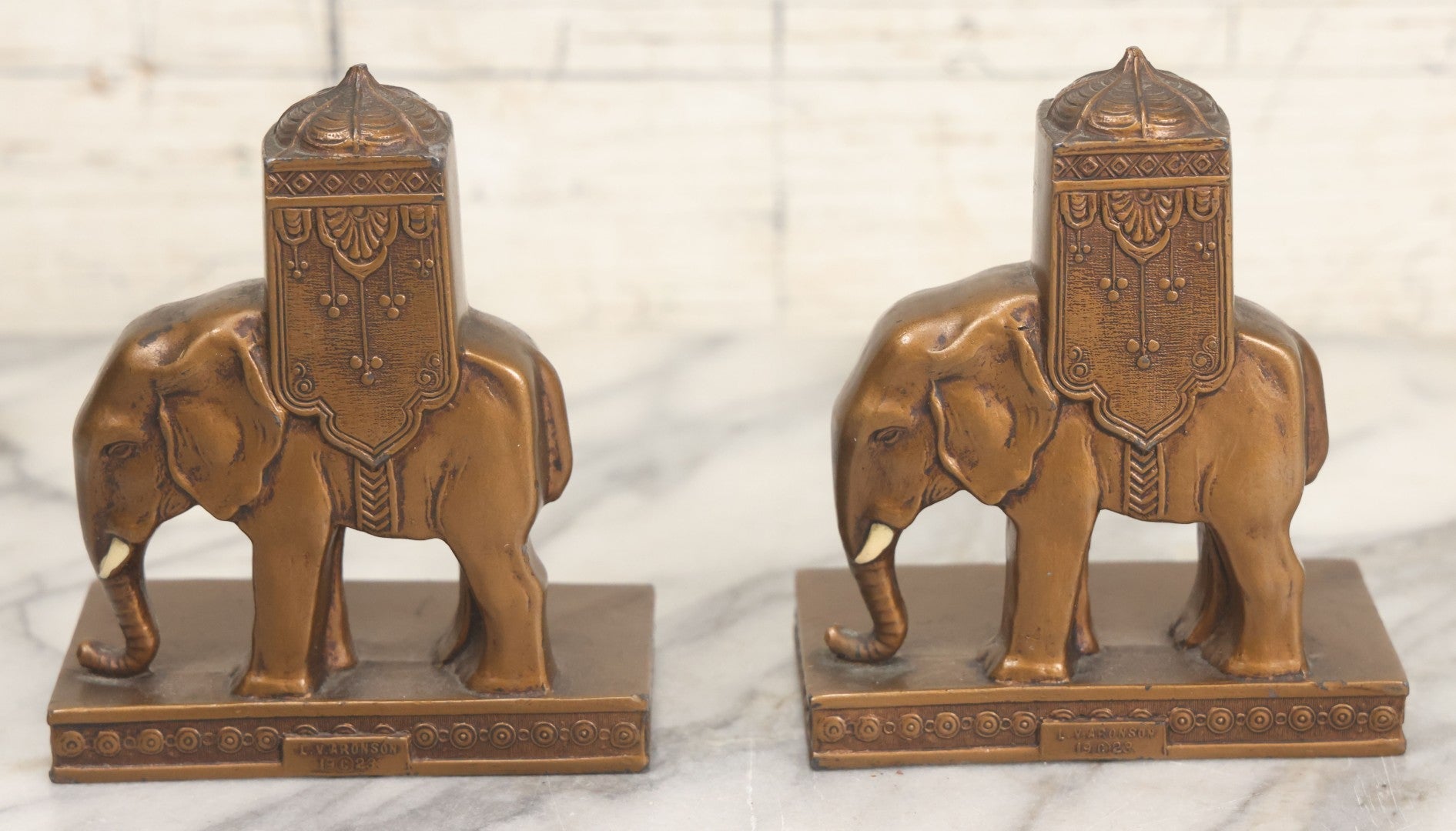 Lot 025 - Pair Of Antique Cast Metal Eastern Influence Elephant Bookends In Bronze Paint Finish, Copyright L.V. Aronson, 1923