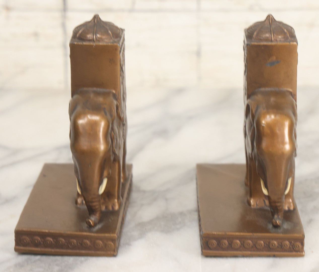 Lot 025 - Pair Of Antique Cast Metal Eastern Influence Elephant Bookends In Bronze Paint Finish, Copyright L.V. Aronson, 1923
