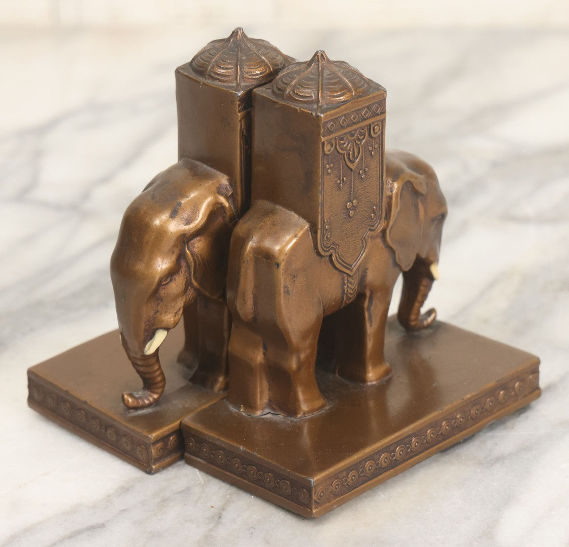 Lot 025 - Pair Of Antique Cast Metal Eastern Influence Elephant Bookends In Bronze Paint Finish, Copyright L.V. Aronson, 1923