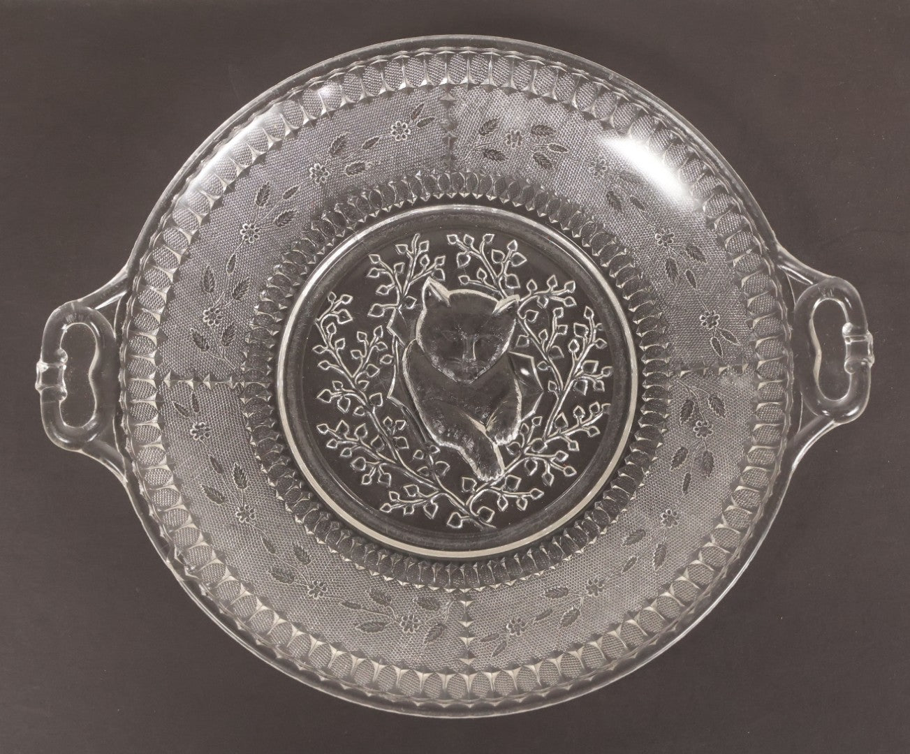 Lot 028 - Antique Early American Pattern Glass E.A.P.G. Plate With Cat Resting In Tree Branches, 9" Diameter