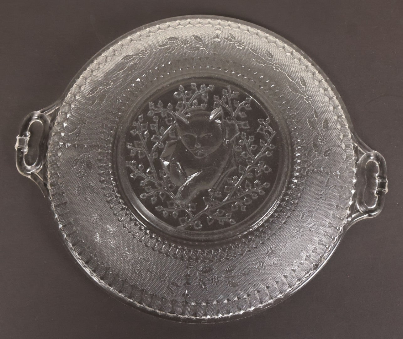 Lot 028 - Antique Early American Pattern Glass E.A.P.G. Plate With Cat Resting In Tree Branches, 9" Diameter