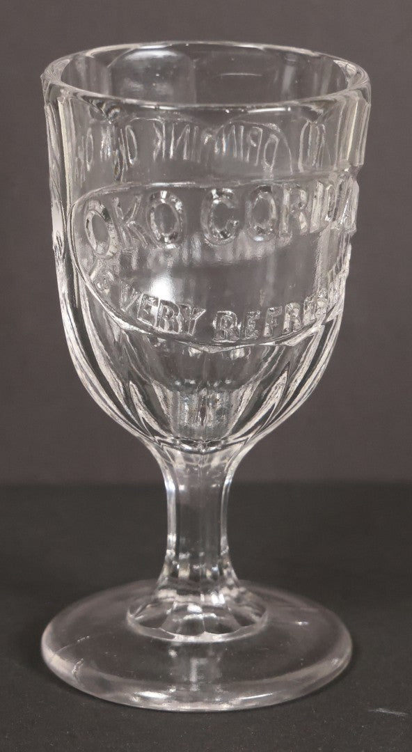 Lot 029 - Antique Pressed Glass Advertising Cup For Oko Cordial, With Slogans "Drink Oko, It Enriches The Blood" And "Oko Cordial Is Very Refreshing," 4" Height