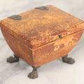 Lot 030 - Antique Leatherette Footed Stash Box With Paper Interior, Black Metal Strap Hinges, And Cloth Feet