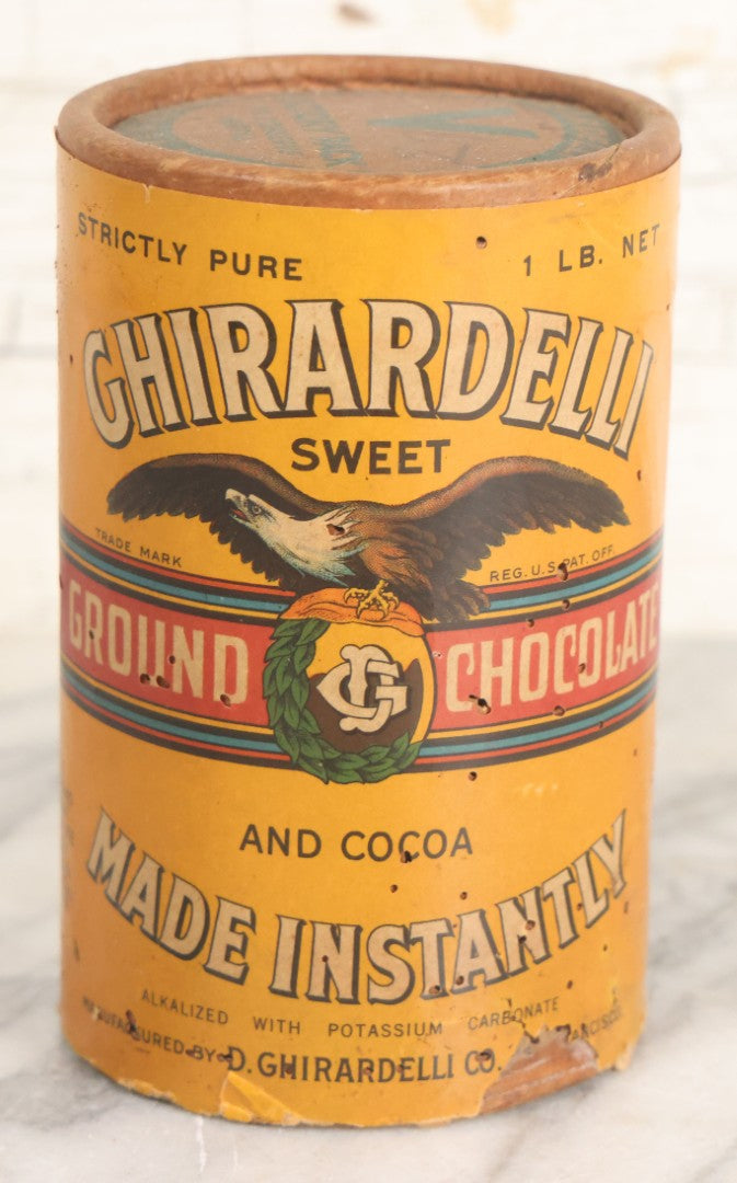 Lot 031 - Vintage Ghirardelli Sweet Ground Chocolate And Cocoa One Pound "Victory Pack" Paper Jar, With Contents, Manufactured By D. Ghirardelli Co., San Francisco, California, 5-1/2" Height