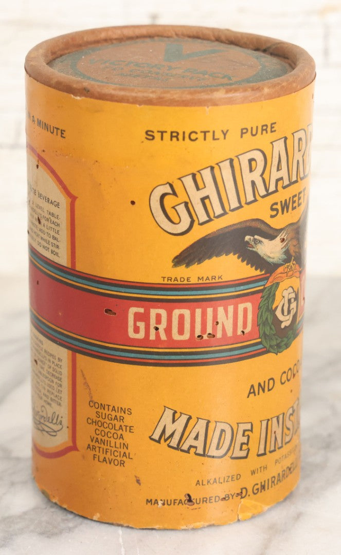 Lot 031 - Vintage Ghirardelli Sweet Ground Chocolate And Cocoa One Pound "Victory Pack" Paper Jar, With Contents, Manufactured By D. Ghirardelli Co., San Francisco, California, 5-1/2" Height