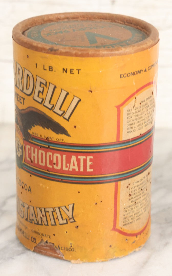 Lot 031 - Vintage Ghirardelli Sweet Ground Chocolate And Cocoa One Pound "Victory Pack" Paper Jar, With Contents, Manufactured By D. Ghirardelli Co., San Francisco, California, 5-1/2" Height