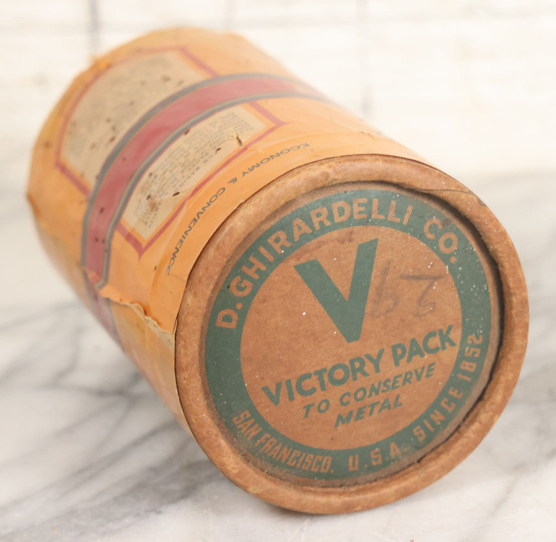 Lot 031 - Vintage Ghirardelli Sweet Ground Chocolate And Cocoa One Pound "Victory Pack" Paper Jar, With Contents, Manufactured By D. Ghirardelli Co., San Francisco, California, 5-1/2" Height