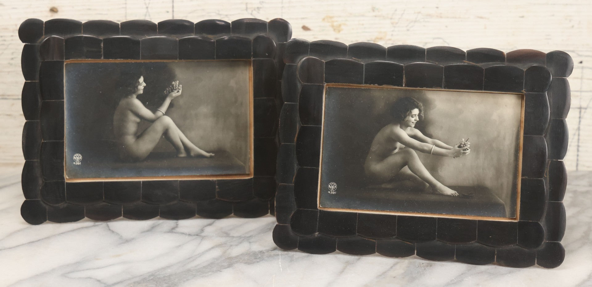 Lot 047 - Pair Of Antique French Nude Postcards Of Women Looking Fondly At Bundle Of Grapes, In Two Poses, Published By Armand Noyer, Series No. 4391, Made In France, In Matching Vintage Frames, 8" x 6" each
