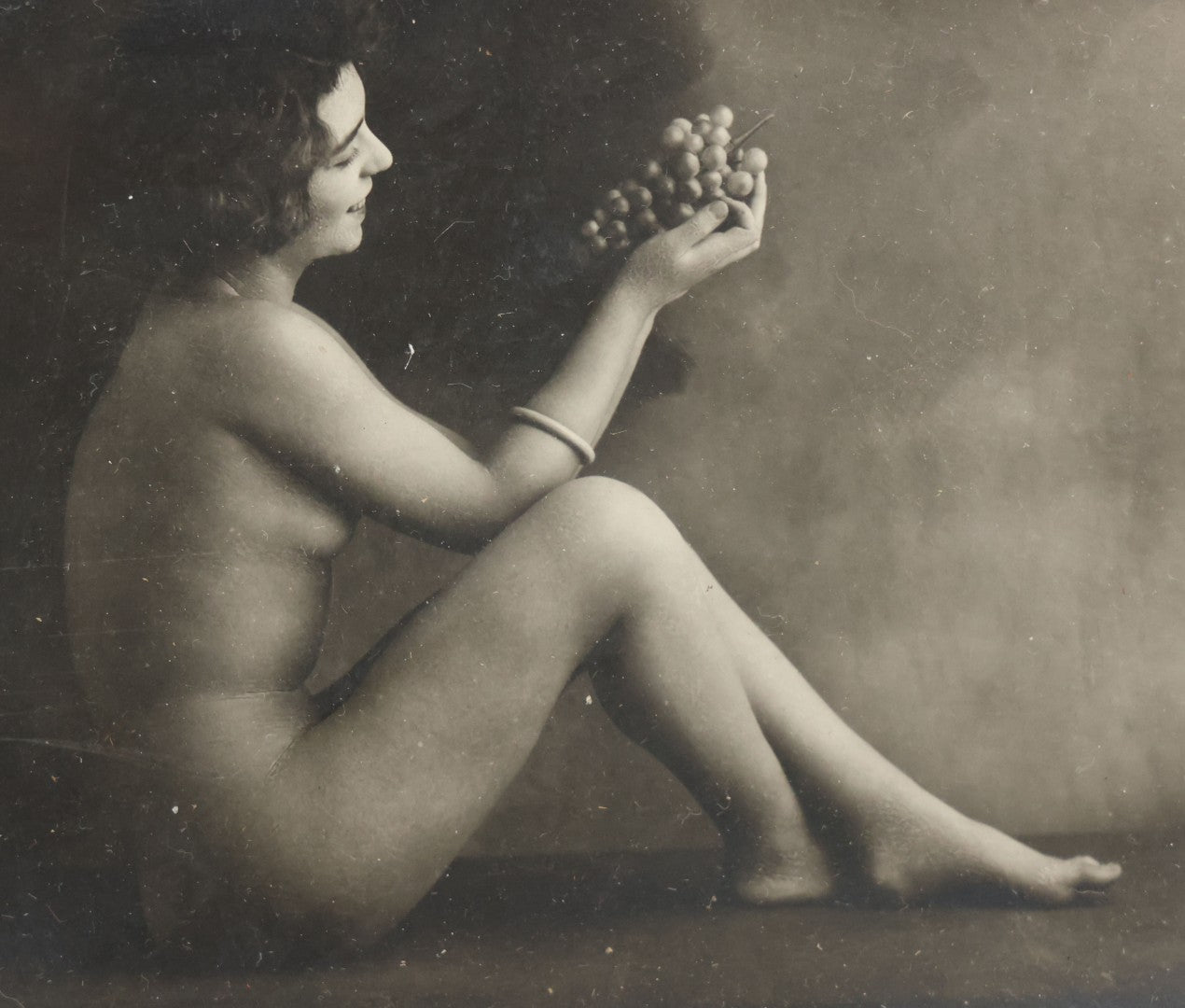 Lot 047 - Pair Of Antique French Nude Postcards Of Women Looking Fondly At Bundle Of Grapes, In Two Poses, Published By Armand Noyer, Series No. 4391, Made In France, In Matching Vintage Frames, 8" x 6" each