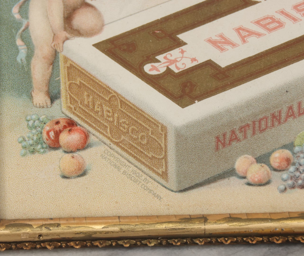 Lot 053 - Antique Nabisco National Biscuit Company Lithographed Advertisement With Woman In Blue Hat And Cherubs, Copyright 1902, In Vintage Frame, 7-1/8" x 9-1/2"