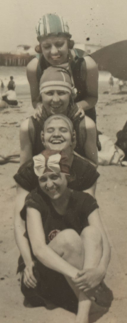 Lot 057 - Antique Tinted Photograph Of Three Ladies In Playful Pose On Beach With Pier In Background, Circa 1925, In Frame, 6-1/2" x 10-3/4"