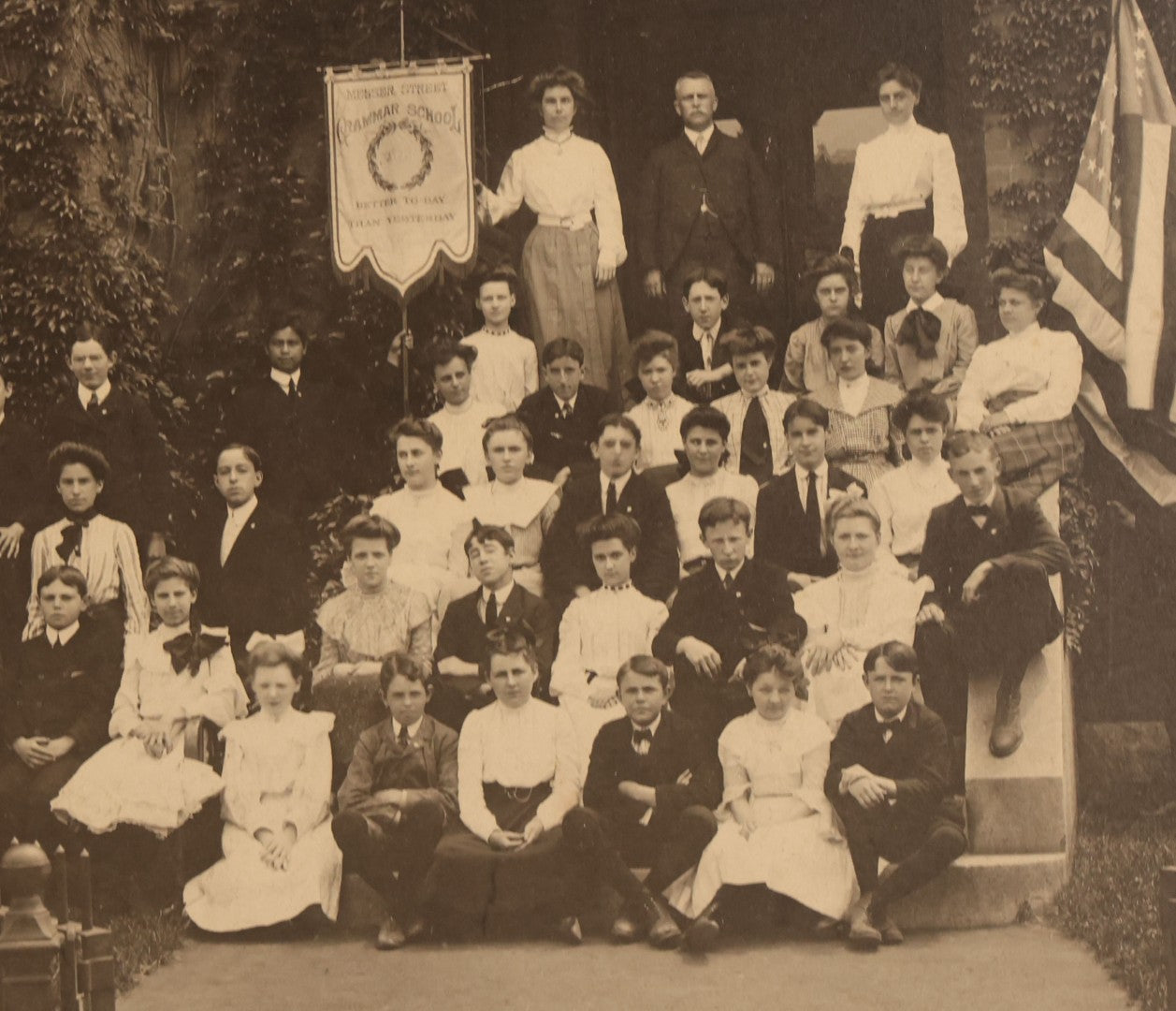 Lot 063 - Antique Boarded Photograph Of The Students And Staff Of The Messer Street Grammar School, Class Of 1893, Posing With Banner On School Steps, William Mills & Son, Photographers, Providence, Rhode Island, In Frame, 18-1/8" x 15-1/8"