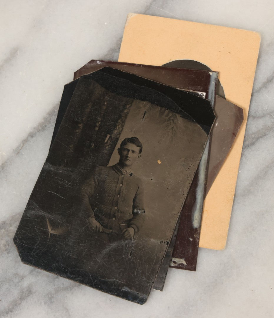 Lot 068 - Grouping Of Ten Antique Tintype Photographs Including Man In Sweater, Man With Well-Groomed Beard, And Strange Slouching Child