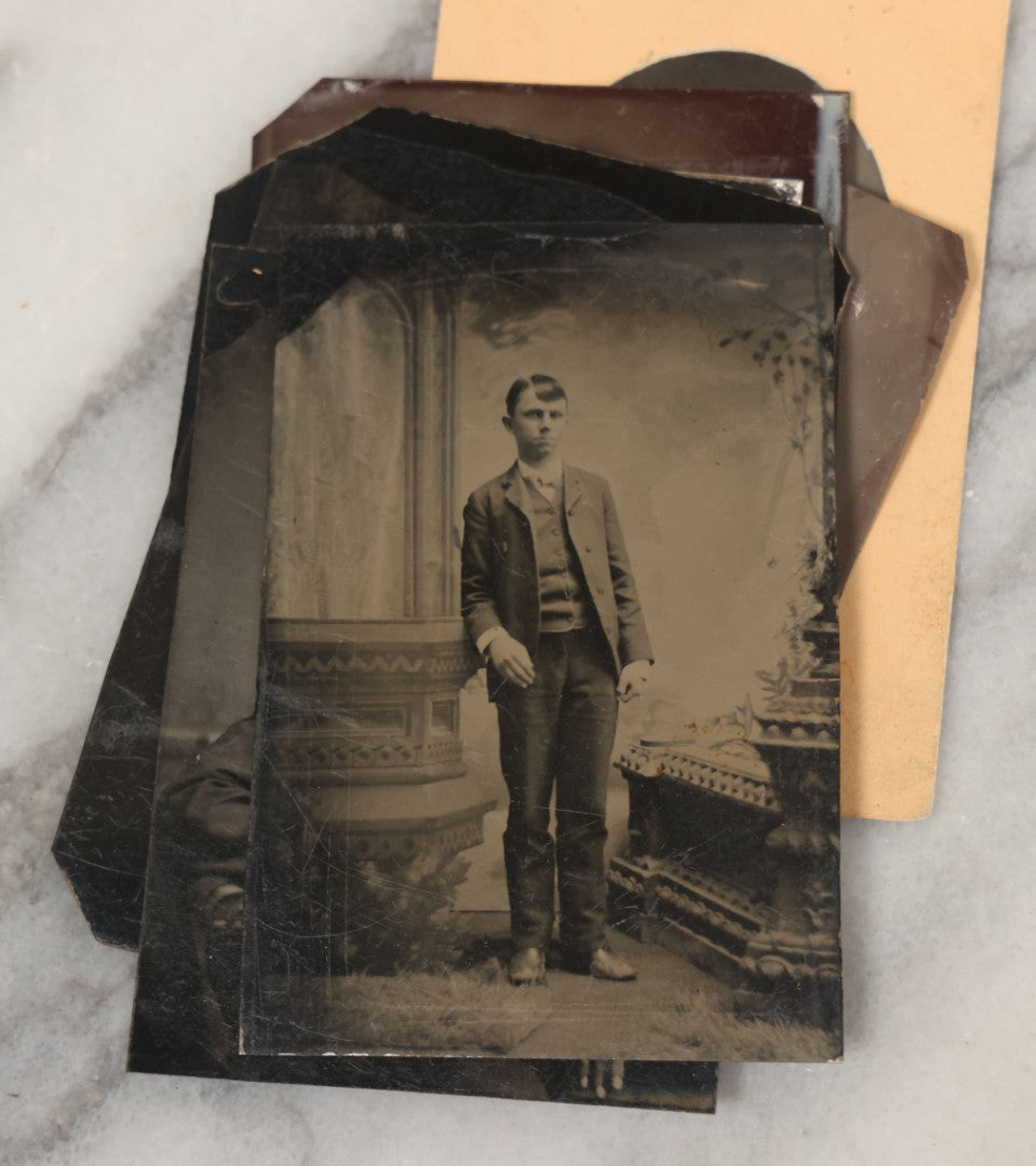 Lot 068 - Grouping Of Ten Antique Tintype Photographs Including Man In Sweater, Man With Well-Groomed Beard, And Strange Slouching Child
