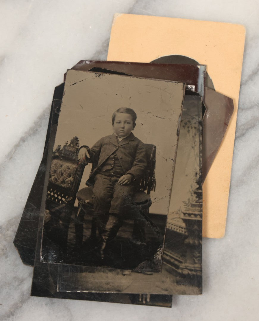 Lot 068 - Grouping Of Ten Antique Tintype Photographs Including Man In Sweater, Man With Well-Groomed Beard, And Strange Slouching Child