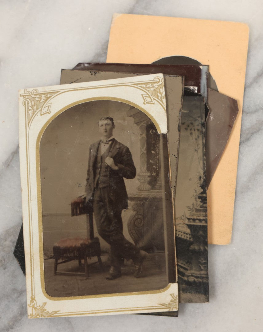 Lot 068 - Grouping Of Ten Antique Tintype Photographs Including Man In Sweater, Man With Well-Groomed Beard, And Strange Slouching Child