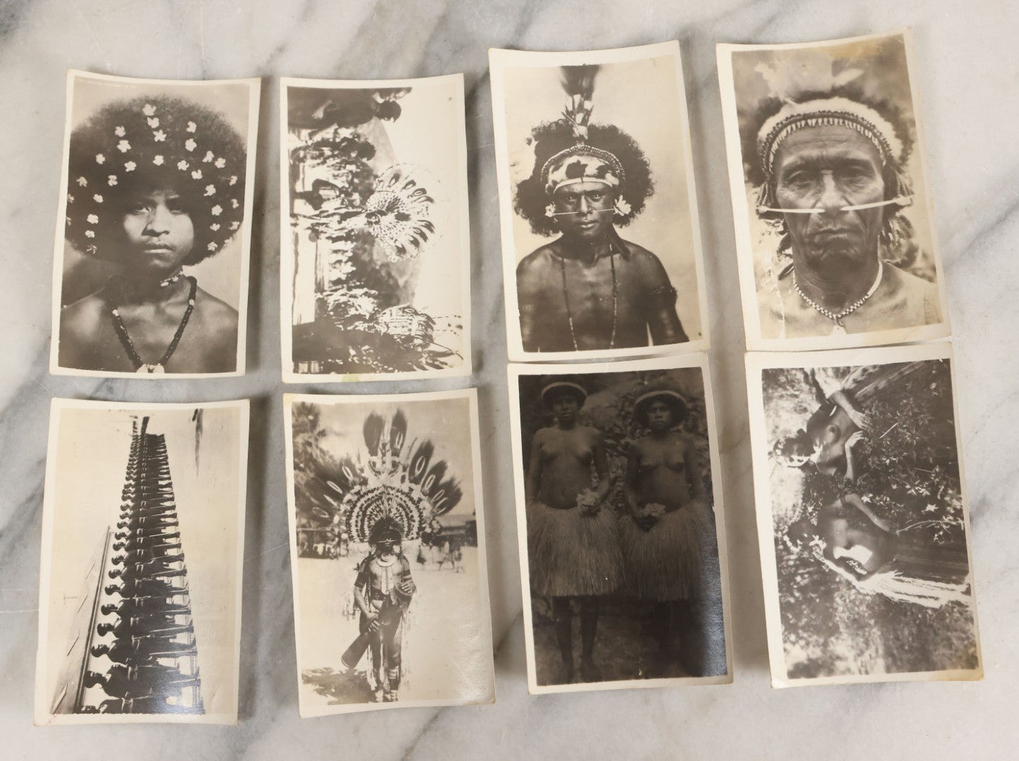 Lot 070 - Grouping Of 26 Vintage Black And White Photographs Of Indigenous Peoples Including Image Of Tattooed Woman And Image Of Tattoo Artist In Practice