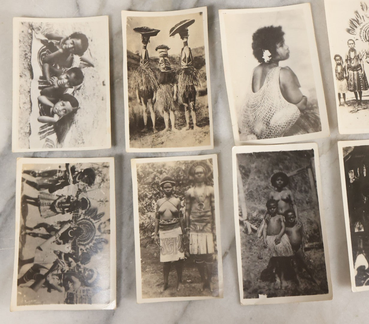 Lot 070 - Grouping Of 26 Vintage Black And White Photographs Of Indigenous Peoples Including Image Of Tattooed Woman And Image Of Tattoo Artist In Practice