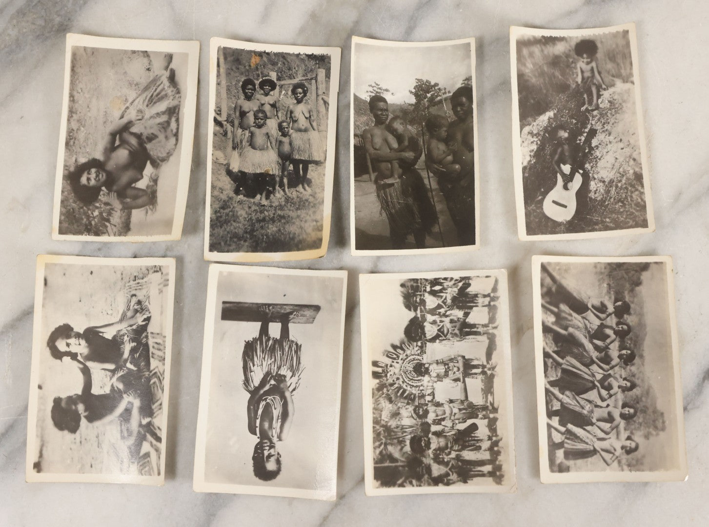 Lot 070 - Grouping Of 26 Vintage Black And White Photographs Of Indigenous Peoples Including Image Of Tattooed Woman And Image Of Tattoo Artist In Practice