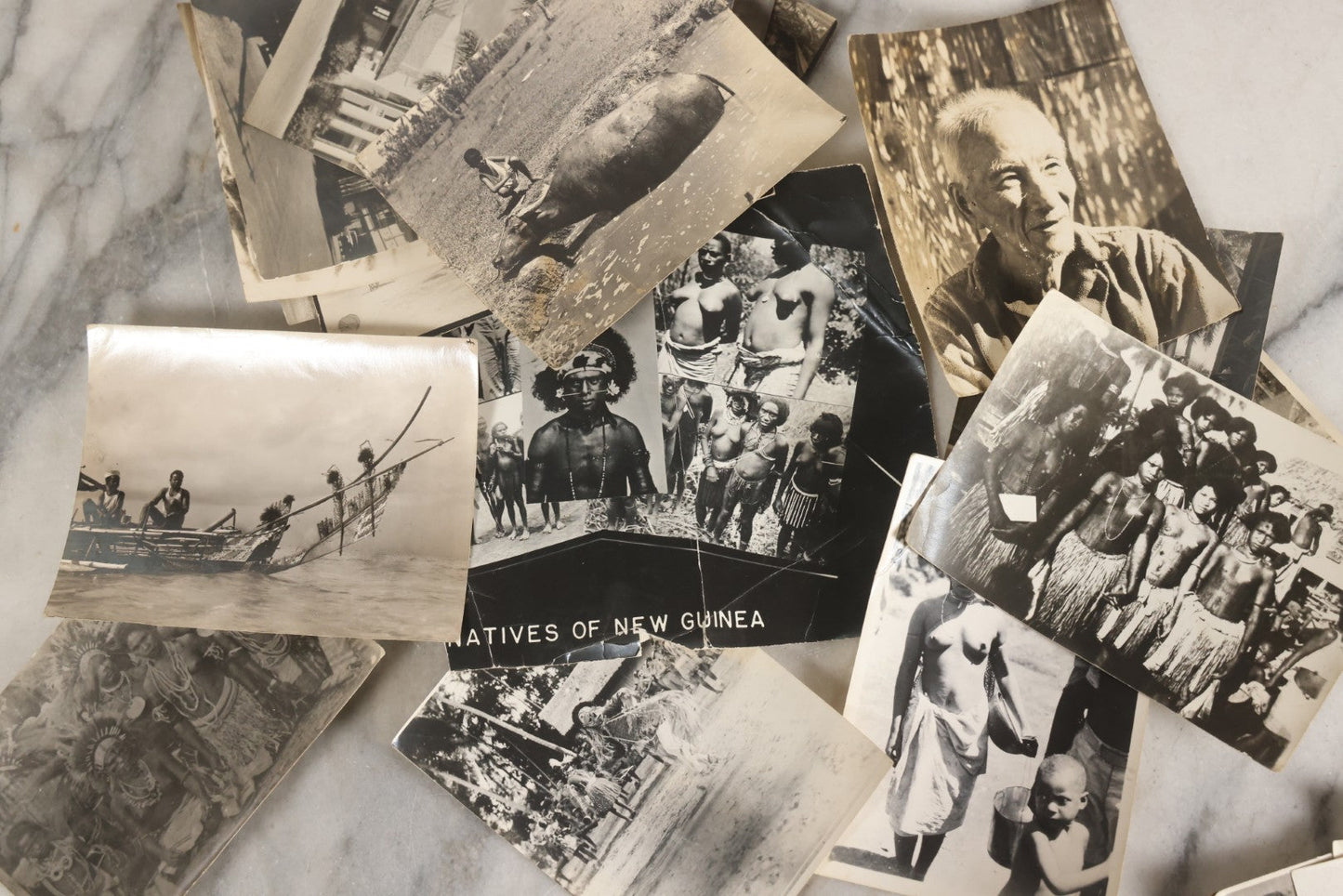 Lot 071 - Grouping Of 32 Vintage Black And White Photographs Of Indigenous Peoples Including Picture Of Man Performing Tribal Dance And Purported Headhunter Tribe Of New Guinea