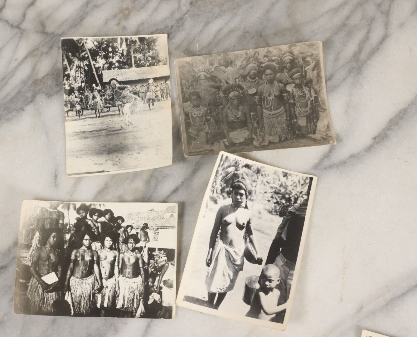 Lot 071 - Grouping Of 32 Vintage Black And White Photographs Of Indigenous Peoples Including Picture Of Man Performing Tribal Dance And Purported Headhunter Tribe Of New Guinea