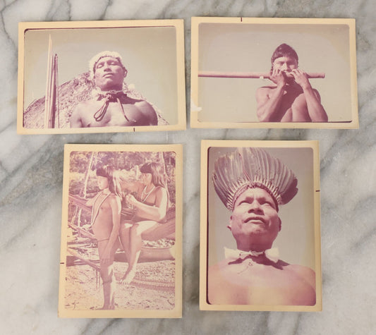 Lot 084 - Grouping Of Four Vintage Color Kodak Snapshot Photographs Of Unidentified Indigenous People Including Man Playing Instrument, Man With Headdress, And Mother With Child