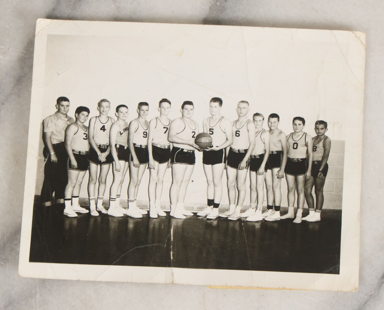 Lot 086 - Grouping Of Fifteen Vintage And Antique Black And White Photographs Of Sports Teams Including 1962 Basketball Team, Early Football Photos, And More