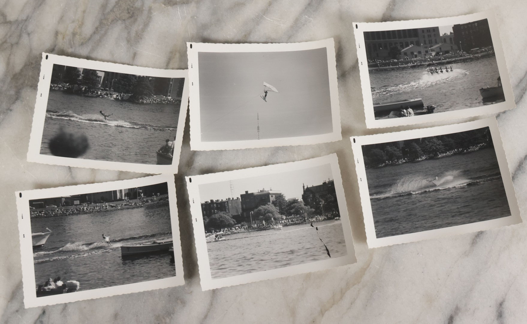 Lot 088 - Grouping Of 25 Vintage Black And White Photographs Of Boating On The Charles River, Boston And Cambridge Mass., Including Photo Of Boston Herald Water Skiers, Sailboats, And Rowing, With Landmarks Including Longfellow Bridge, Universities