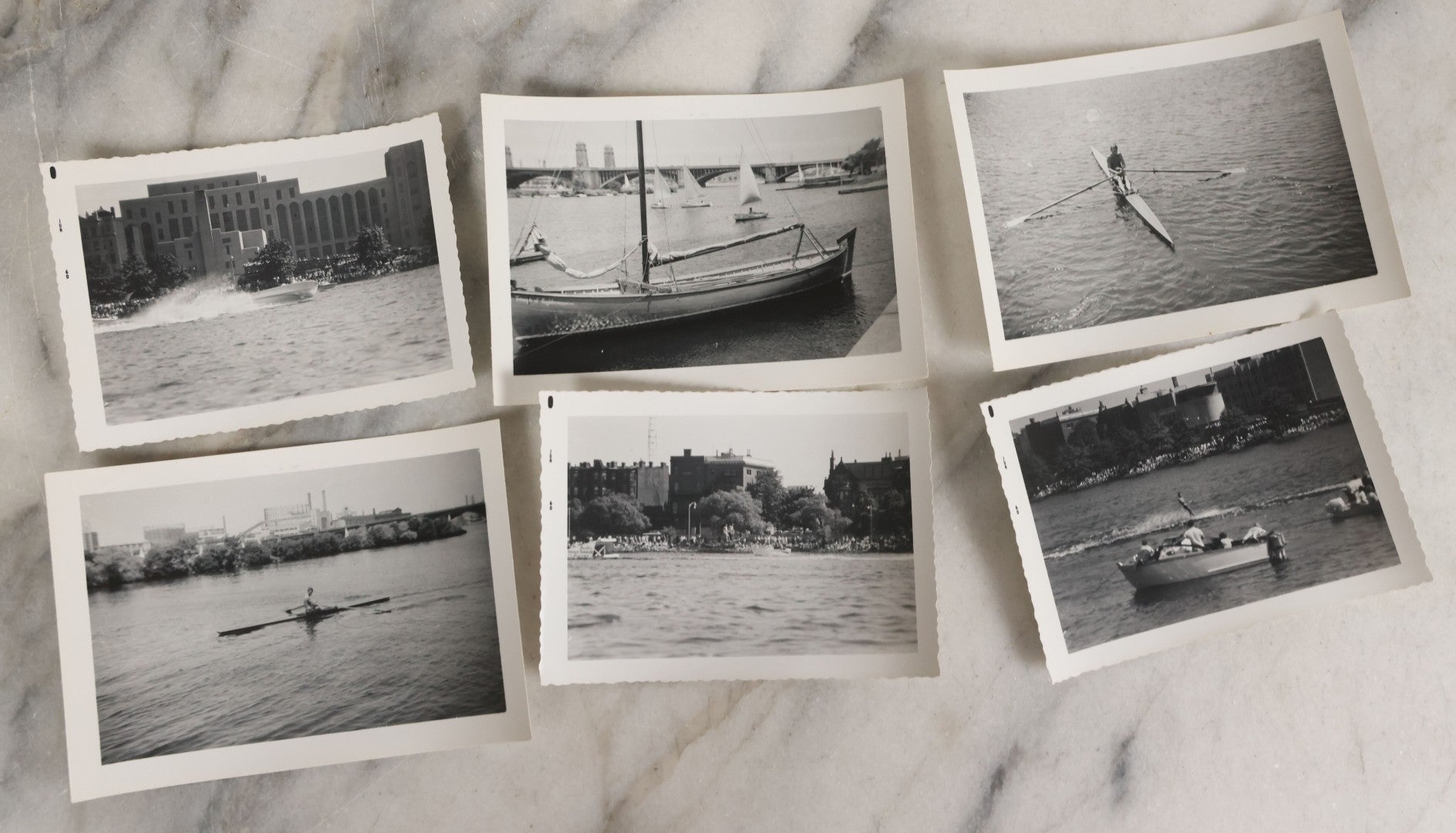 Lot 088 - Grouping Of 25 Vintage Black And White Photographs Of Boating On The Charles River, Boston And Cambridge Mass., Including Photo Of Boston Herald Water Skiers, Sailboats, And Rowing, With Landmarks Including Longfellow Bridge, Universities
