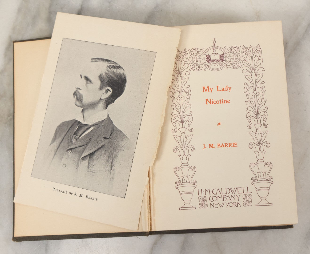 Lot 107 - "My Lady Nicotine" Antique Book By J.M. Barrie, Containing Musings And Stories Related To Smoking, Nicotine, And Tobacco, H.M. Caldwell Company, Publisher, New York, Circa 1900