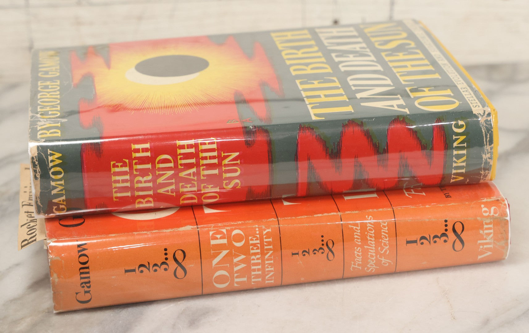 Lot 119 - "One, Two, Three... Infinity: Facts & Speculations Of Science" (1947) And "The Birth And Death Of The Sun: Stellar Evolution And Subatomic Energy" (1940) Pair Of Vintage Books Written And Illustrated By George Gamow, The Viking Press, New York