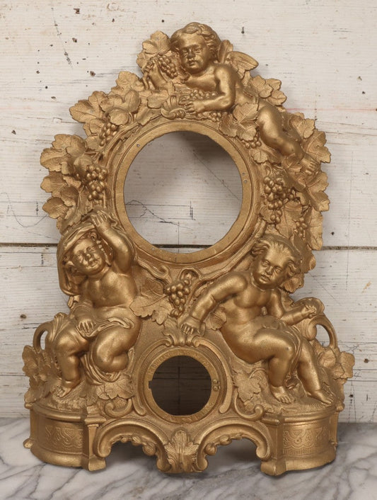 Lot 009 - Antique Gold Painted Cast Metal Figural Clock Front With Cherubs And Grapes Motifs, Marked N. Muller, N.Y. No. 49 Patented 1856, 15" x 18-3/4"