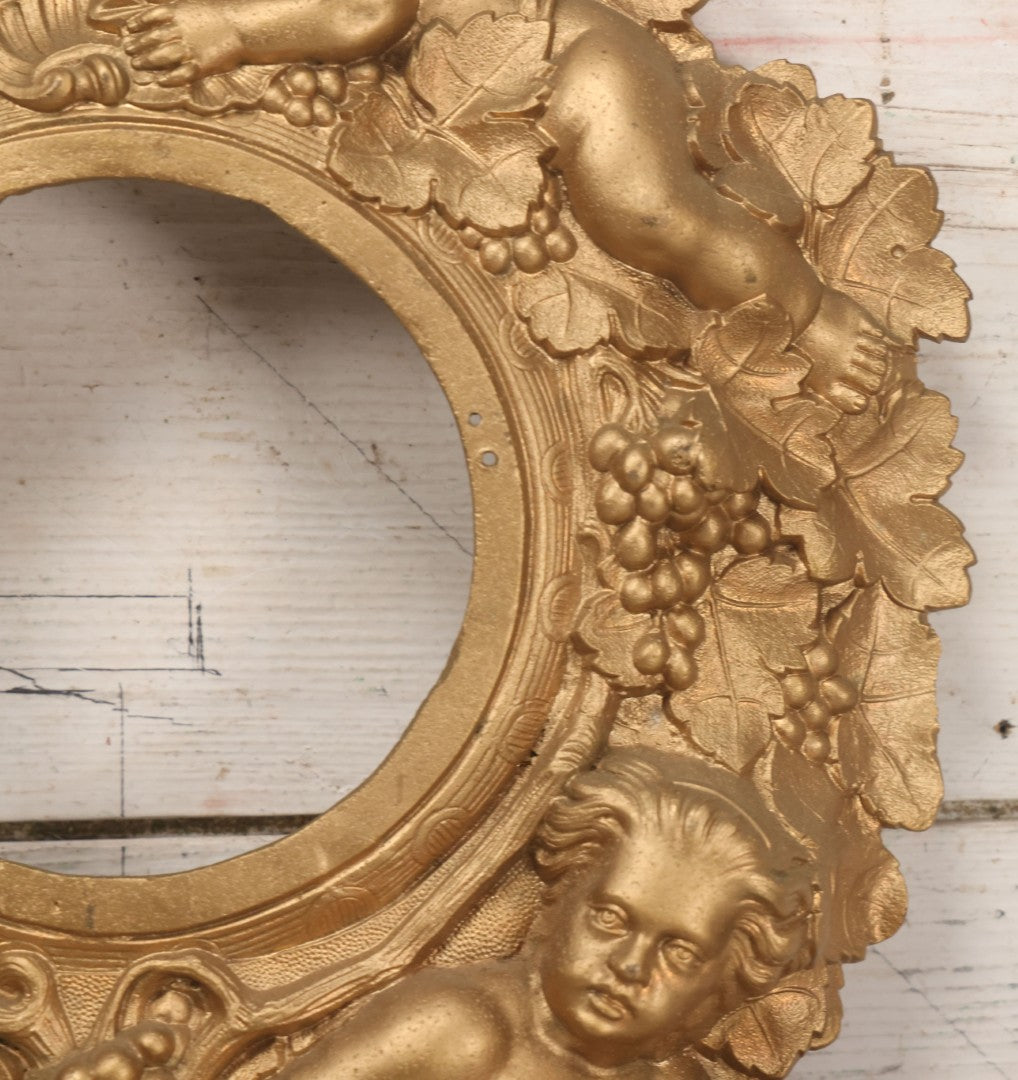 Lot 009 - Antique Gold Painted Cast Metal Figural Clock Front With Cherubs And Grapes Motifs, Marked N. Muller, N.Y. No. 49 Patented 1856, 15" x 18-3/4"