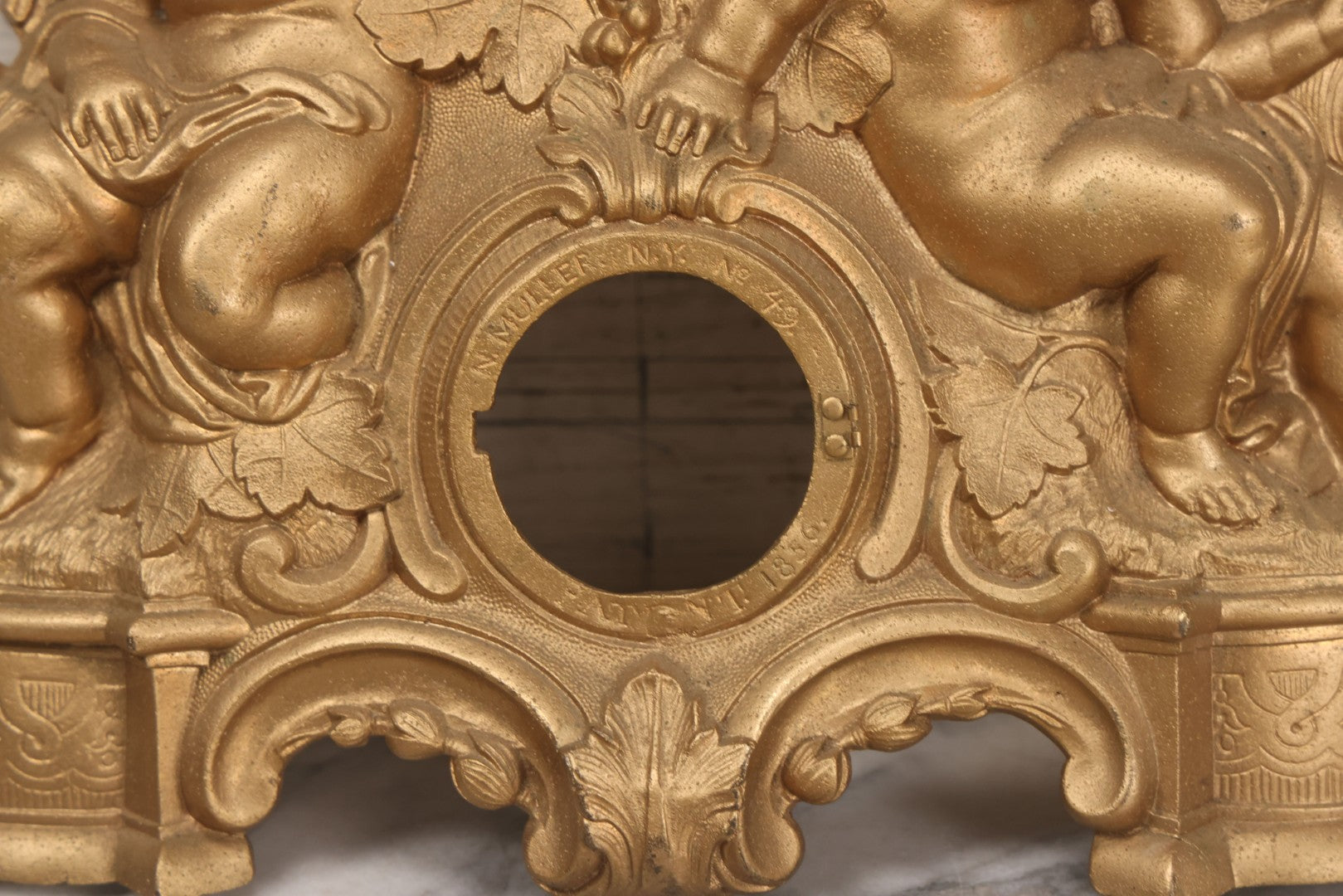 Lot 009 - Antique Gold Painted Cast Metal Figural Clock Front With Cherubs And Grapes Motifs, Marked N. Muller, N.Y. No. 49 Patented 1856, 15" x 18-3/4"