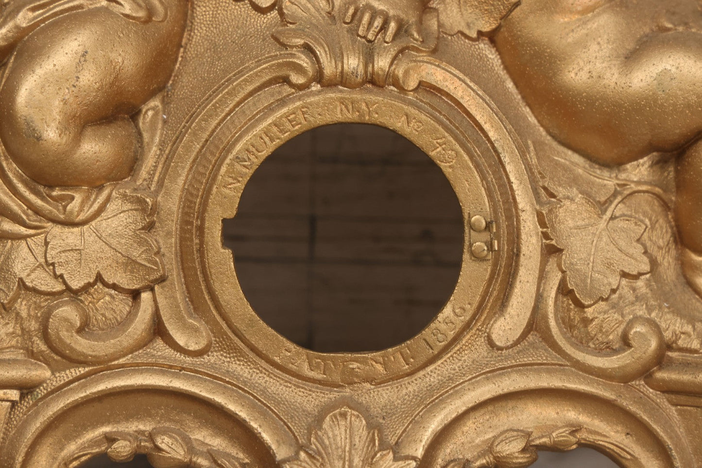 Lot 009 - Antique Gold Painted Cast Metal Figural Clock Front With Cherubs And Grapes Motifs, Marked N. Muller, N.Y. No. 49 Patented 1856, 15" x 18-3/4"