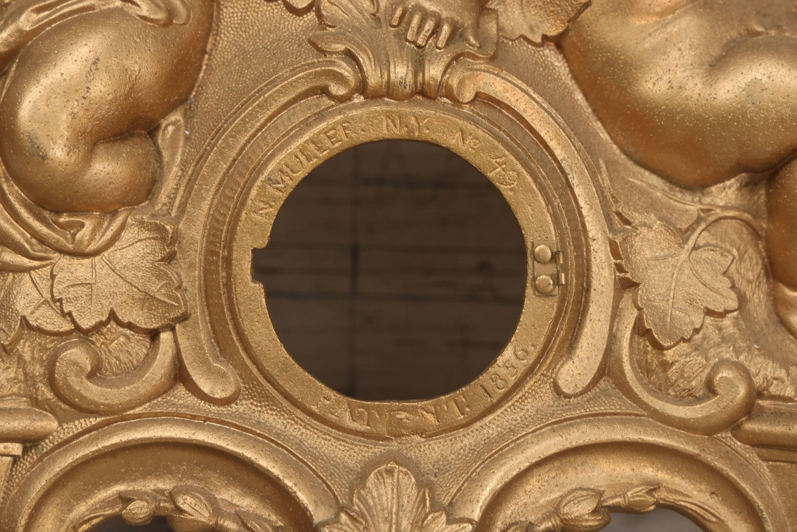 Lot 009 - Antique Gold Painted Cast Metal Figural Clock Front With Cherubs And Grapes Motifs, Marked N. Muller, N.Y. No. 49 Patented 1856, 15" x 18-3/4"