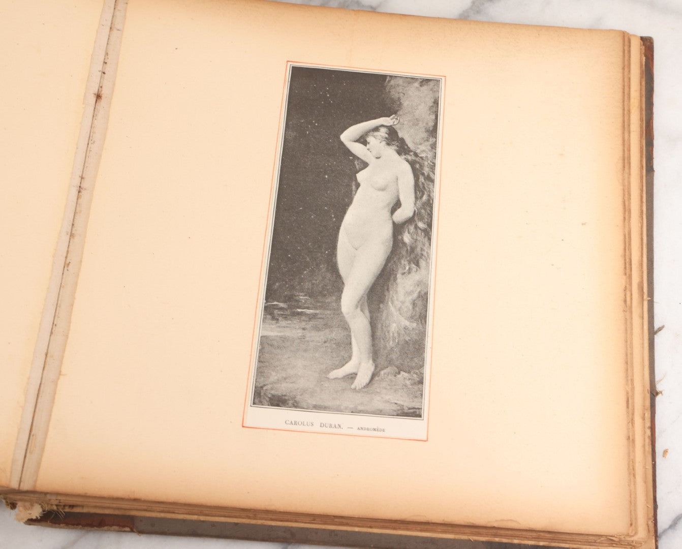 Lot 012 - Antique Scrapbook Containing Many Fine Art Prints, Clippings, And Scraps, With Handwritten Titles And Hand Painted Red Pinstriping, Works Include "The Fortuneteller" After A. Glisbenti, "Isabella With The Head Of Lorenzo," And Others