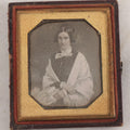 Lot 014 - Antique 1/6th Plate Daguerreotype Photograph Of A Woman Draped In Fabric Shawl With Unique Hairstyle In Half Leatherette Case With Eagle Motif