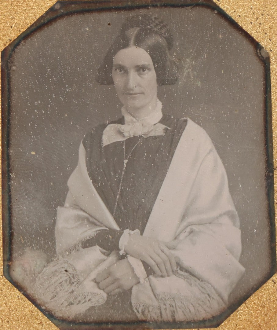 Lot 014 - Antique 1/6th Plate Daguerreotype Photograph Of A Woman Draped In Fabric Shawl With Unique Hairstyle In Half Leatherette Case With Eagle Motif