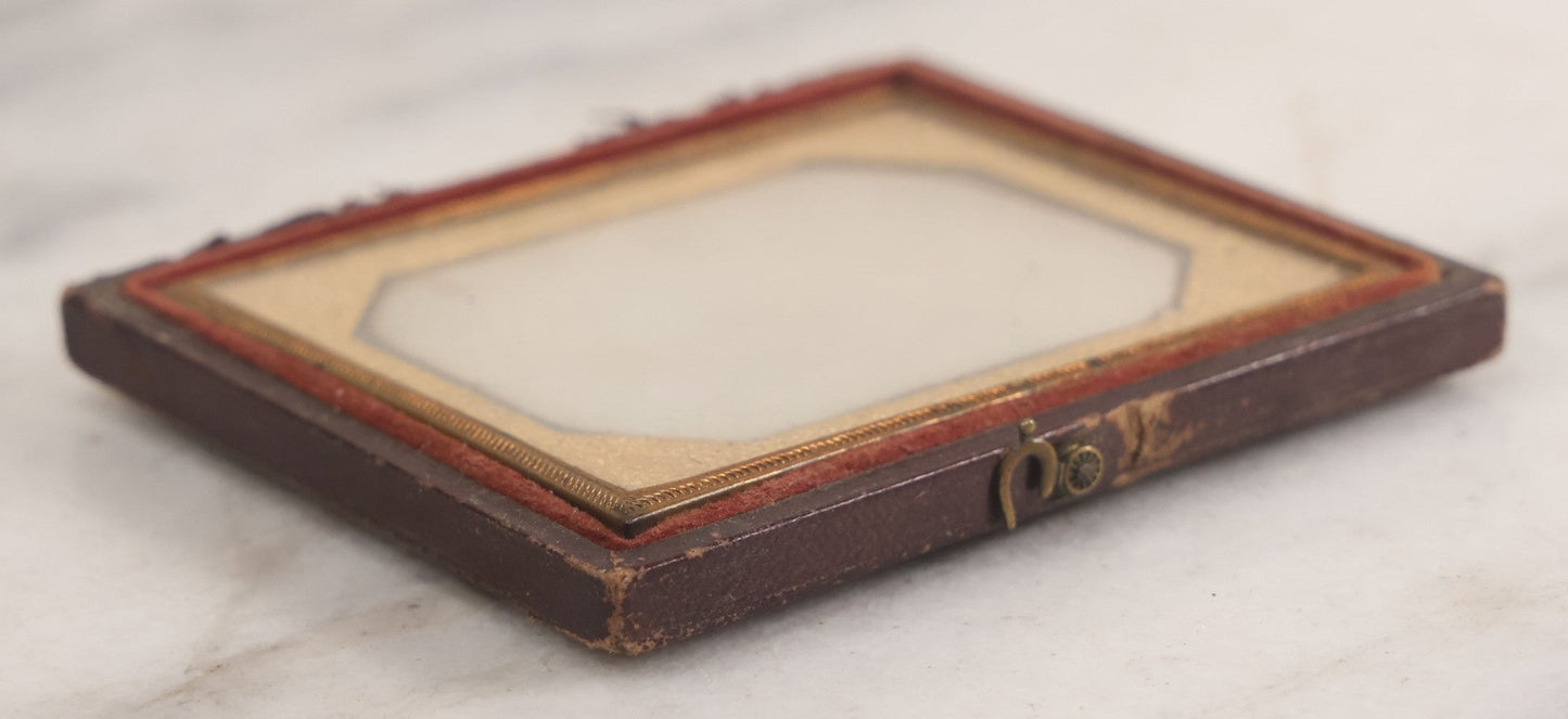 Lot 014 - Antique 1/6th Plate Daguerreotype Photograph Of A Woman Draped In Fabric Shawl With Unique Hairstyle In Half Leatherette Case With Eagle Motif