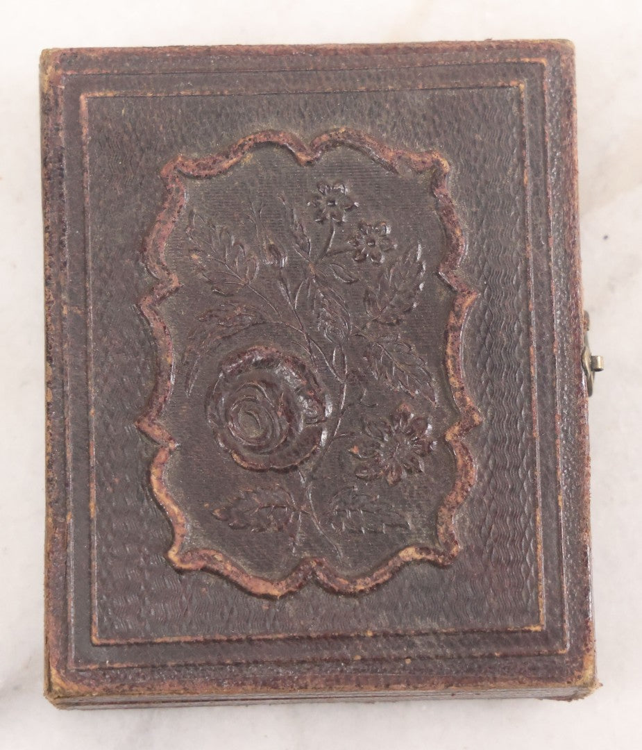 Lot 015 - Antique 1/9th Plate Daguerreotype Photograph Of Young Woman With Striking Eyes, White Collar, And Bonnet With Long Dark Lappets, In Full Intact Leatherette Union Case With Rose Motif