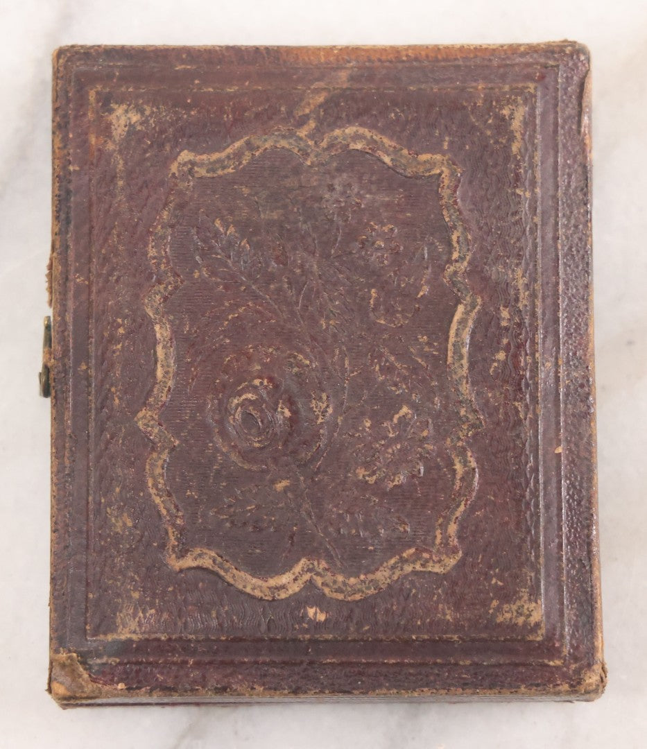 Lot 015 - Antique 1/9th Plate Daguerreotype Photograph Of Young Woman With Striking Eyes, White Collar, And Bonnet With Long Dark Lappets, In Full Intact Leatherette Union Case With Rose Motif