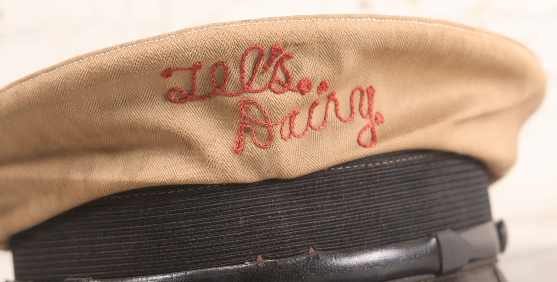 Lot 018 - Vintage "Tel's Dairy" Hand Embroidered Milkman's Cap With Red Stitching On Beige Fabric, Size 7-1/4